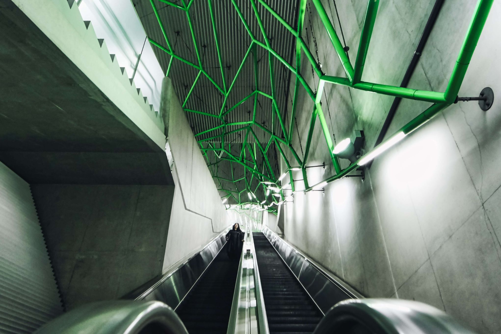 The green spider web like installation above the escalator is one of a kind in Tokyo. There are two installations like this on two escalators. Check both of them out first before spending too much time on one.
